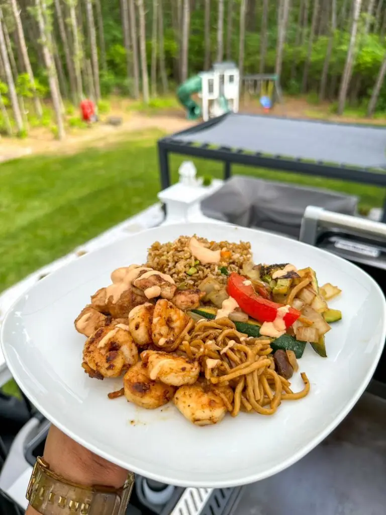 Fresh hibachi at home menu options featuring steak, shrimp, scallops, and hibachi vegetables on a grill.